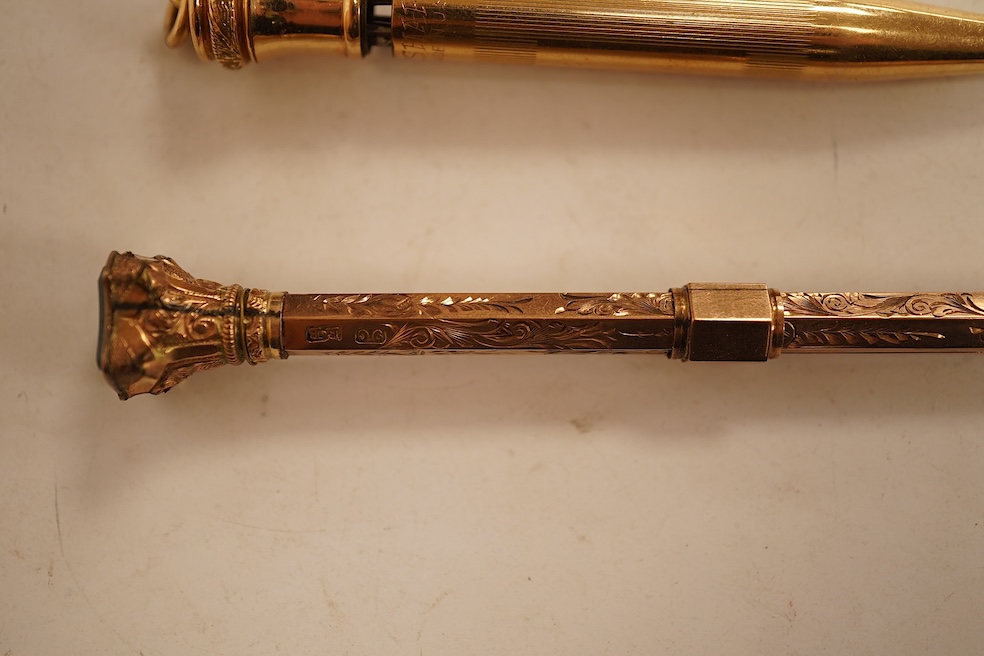 A 9ct gold propelling pencil with engine turned decoration and inset bloodstone terminal and a plain gold filled propelling pencil, largest 11.5cm in length